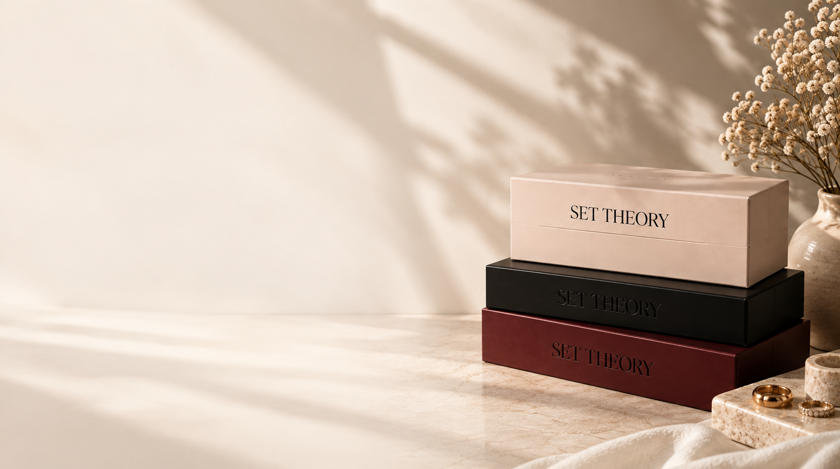 Set Theory packaging design concept in cream, black and burgundy